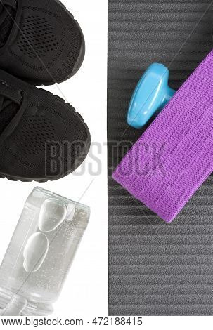 Top View Yoga Mat Dumbbeell, Shoe, Bottle Of Water And Fitness Elastic Band. Concept Sport And Healt