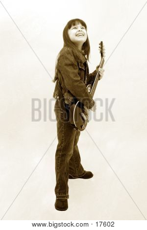 Child Playing Electric Guitar In Sepia