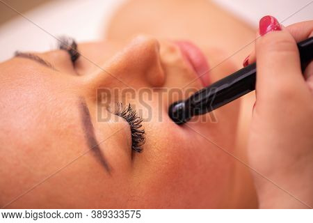 Close Up Of A Woman’s Face During A Cosmetics Treatment With Stone Wand